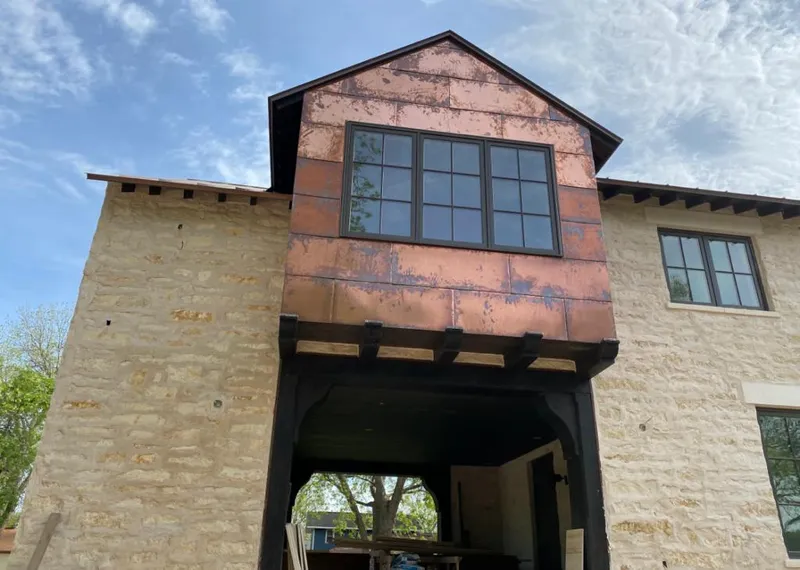 Copper metal panel facade on a stone building for Metal Roof Coating in Lombard